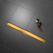 Imagen de Canaleta de ducha dourado con rejilla lisa/baldosa
